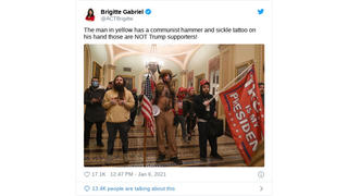 Fact Check: Man Pictured Inside Capitol Does NOT Have A Hammer And Sickle Tattoo On His Hand