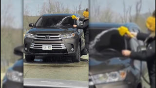 Fact Check: Woman In Video Did NOT Really Wash Her Car With Gasoline -- It's A Skit