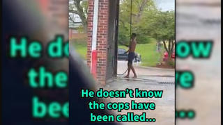 Fact Check: Police Officer Did NOT Assist Homeless Man Showering In Car Wash -- It's a Skit