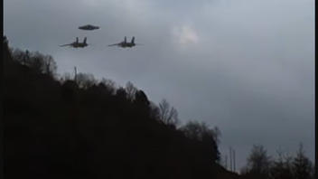 Fact Check: Video Of UFO Escorted By 2 Jets Is NOT Real -- CGI Effects For Entertainment