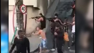 Fact Check: Video Does NOT Show Brazilian Gang Intimidating Police -- It's Movie Production 