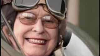 Fact Check: Photo Of Queen Elizabeth In WWII Spitfire Fighter Plane Is NOT Authentic -- Image Edited To Add Her Face