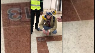 Fact Check: Recent Ukrainian Refugee Did NOT Paint Swastika In London Mall -- Video Dates From 2018