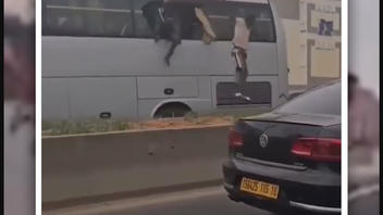 Fact Check: Migrants Filmed Jumping From Bus Were NOT In Germany -- Filmed In Algeria