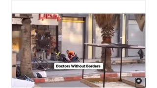 Fact Check: Video Does NOT Show Doctors Without Borders Medic Picking Up Gun And Carrying It Away -- Man Wears PMRC Vest