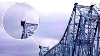 Fact Check: Photo Showing Black Figure On Bridge Does NOT Show Baltimore Bridge Shortly Before Collapse -- It's Old Picture, Different Bridge