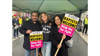 Fact Check: Edited Photo Shows 'Rapists Welcome' And 'Stand Up For Rapists' Signs -- Originals Said 'Refugees Welcome' And 'Stand Up To Racism'