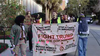 Fact Check: Photo Does NOT Show Phoenix Ikner Marching Behind Anti-Trump Banner During Demonstration -- Different Person