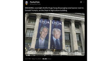 Fact Check: Antifa Did NOT Hang Jeffrey Epstein Banner Next To Donald Trump's On Department of Agriculture Building -- Parody