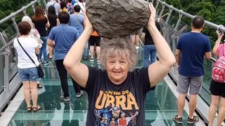 Fact Check: AI Video Shows Glass Bridge Collapsing After Woman Falls And Drops Rock On It -- Created For Entertainment Purposes