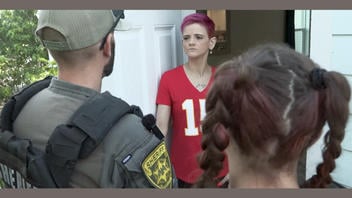 Fact Check: Video Of Sheriff's Deputy Asking Purple-Haired Woman About Color Of Her Carpet And Curtains Is NOT Authentic 