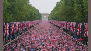 Fact Check: Image Of British Union Jack Flags Crowding The Mall In London Is NOT Real -- Shows Paris's Arc De Triomphe, Not Admiralty Arch