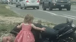 Fact Check: Girl In Princess Dress Helping An Injured Biker Is NOT Real -- There's No 'Ashford' On Route 27 And The Picture Is AI-Generated