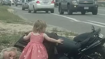 Fact Check: Girl In Princess Dress Helping An Injured Biker Is NOT Real -- There's No 'Ashford' On Route 27 And The Picture Is AI-Generated