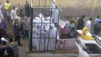 Fact Check: Photo Does NOT Show ISIS Parading Caged Yazidi Women In Mosul Before Burning Them To Death - It's A 2013 Street Protest In Egypt