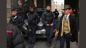 Fact Check: Dapper Man Photographed Near Paris Louvre Is NOT A French Detective Working Case Of Stolen Crown Jewels -- A Member Of The Public