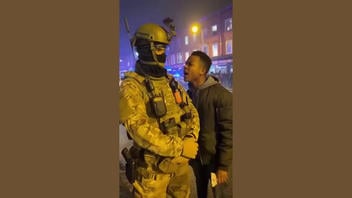 Fact Check: Fake Video Of Shouting Protester Getting Pepper Sprayed In The Face By A Riot Police Officer -- It's AI-Generated