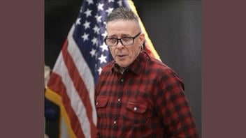 Fact Check: FAKE Image Of Gregory Bovino Shows Plaid Shirt With Earring When He Actually Wore A Green Uniform