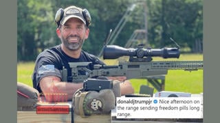 Fact Check: Image Of Donald Trump Jr. With Rifle Scope Mounted Backwards Has Been Digitally Edited