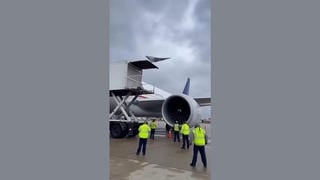 Fact Check: Fake Video Shows Ground Crew Struggling Near A Jet Engine To Retrieve A Piece Of Metal That Has Almost Been Sucked In