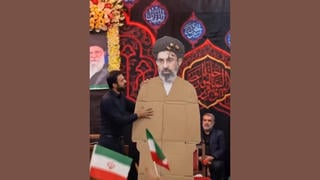 Fact Check: FAKE Video Shows Iranian Crowd Cheering For Cardboard Cutout Of Ayatollah Mojtaba Khamenei