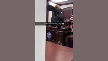 Fact Check: Video Showing A Judge Dancing On Her Desk Is NOT Real -- It's A Comedy Sketch