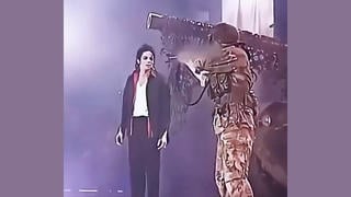Fact Check: Video Does NOT Show Real Attacker Threatening Michael Jackson With A Rifle On Stage -- It Was A Scripted Concert Scene