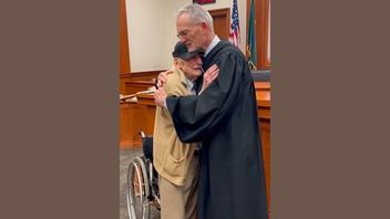 Fact Check: FAKE Image Of Judge Hugging '88-Year-Old Man Named Vietnam Veteran' Is NOT Real Photo