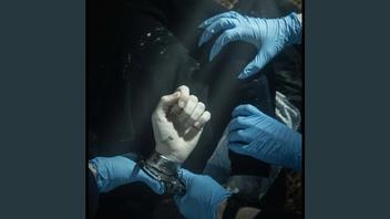 Fact Check: EDITED Image Falsely Shows 'Claw' Hand Of Police Officer Arresting Fatally Stabbed Student Henry Nowak