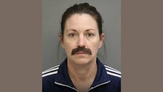 Fact Check: FAKE Mugshot Shows Woman Arrested For Disguising Herself As A Man To Enter A BBQ Competition
