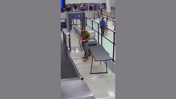 Fact Check: FAKE Video Shows Military Dog Jumping Barrier After Seeing Former Handler At TSA Checkpoint