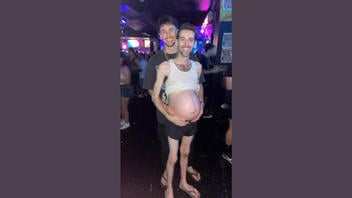 Fact Check: Multiple Glitches Reveal Two Different FAKE AI-Generated Scenes Of A Pregnant Man With His Partner At A Nightclub