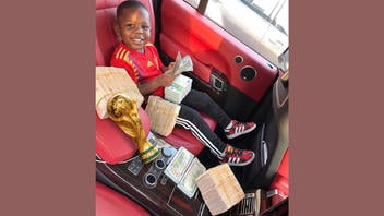 Fact Check: FAKE Image Shows Lamine Yamal's Little Brother Keyne With Cash And World Cup Trophy -- Made With AI