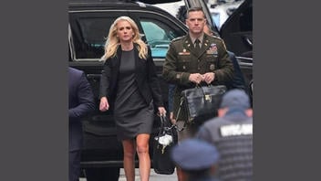 Fact Check: ALTERED Photo Shows Army Officer With 'Nuclear Football' Chained To 'Diaper Bag' 