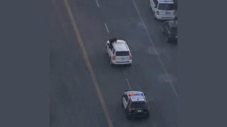 Fact Check: FAKE Video Shows Suspect Climbing On SUV To Taunt Police During LA Car Chase