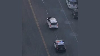 Fact Check: FAKE Video Shows Suspect Climbing On SUV To Taunt Police During LA Car Chase
