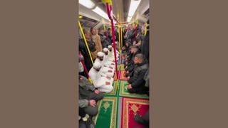 Fact Check: FAKE Video Shows Muslim Men Praying On The London Tube -- It's AI-Generated