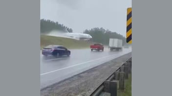 Fact Check: FAKE Video Shows A Fiery Crash Landing Of A Passenger Plane On A Wet Georgia Highway -- AI-Generated