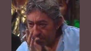 Fact Check: Video Does NOT Show 'Farmer François Lavigne' Reliving Accident On French TV While Dressed-Up Children Sing To Him -- It Is A Serge Gainsbourg Tribute