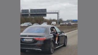 Fact Check: FAKE Video Shows Cyclist Powering A Mercedes Car On The Autobahn -- It Is AI-Generated