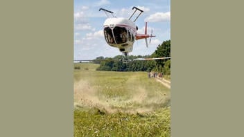 Fact Check: FAKE Video Shows Helicopter Landing Upside Down In A Field -- AI-Generated