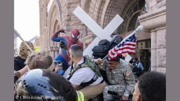 Fact Check: REAL Photo Shows 'Minneapolis Spider-Man' Winding Up To Punch Jake Lang At Protest