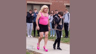 Fact Check: FAKE Image Of Dad Dressed In Wife's Clothes To Pick Up Son From School -- It Is AI-Generated
