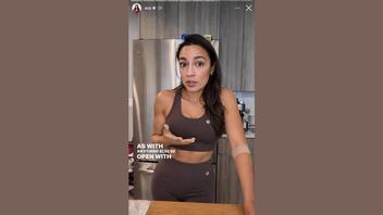 Fact Check: FAKE Image Shows AOC Wearing Workout Clothes In Her Kitchen -- Original Is Sleeveless Polka-Dot Dress