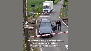Fact Check: FAKE Video Of Truck Pushing Car From Railway Crossing Does NOT Document Real Event