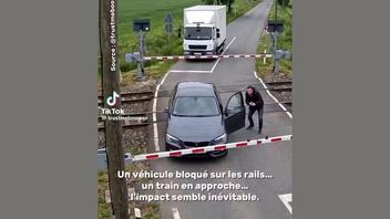Fact Check: FAKE Video Of Truck Pushing Car From Railway Crossing Does NOT Document Real Event