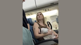 Fact Check: Video Of Breast-Feeding Flight Passenger Is NOT On A Real Flight -- It Is A Skit