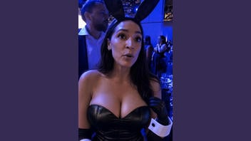 Fact Check: FAKE Images Show AOC In Bunny Outfit, Blue Low-Cut Dress -- They Were Made With AI