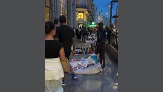 Fact Check: Video Shows Madrid Street Vendors NOT Paris Looters -- Footage Predates Recent French Rioting